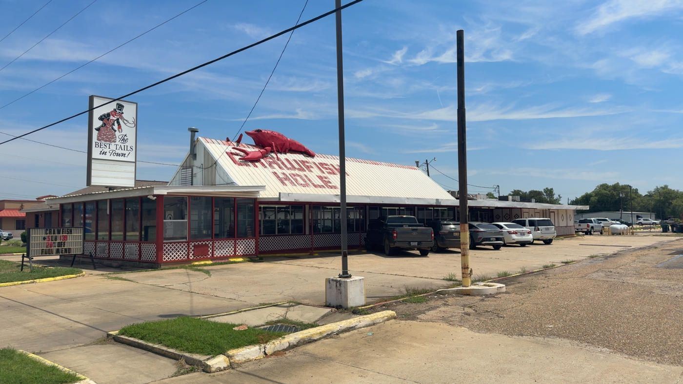 The Crawfish Hole building and sign